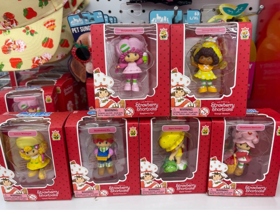 6 Strawberry Shortcake Figurines on a shelf