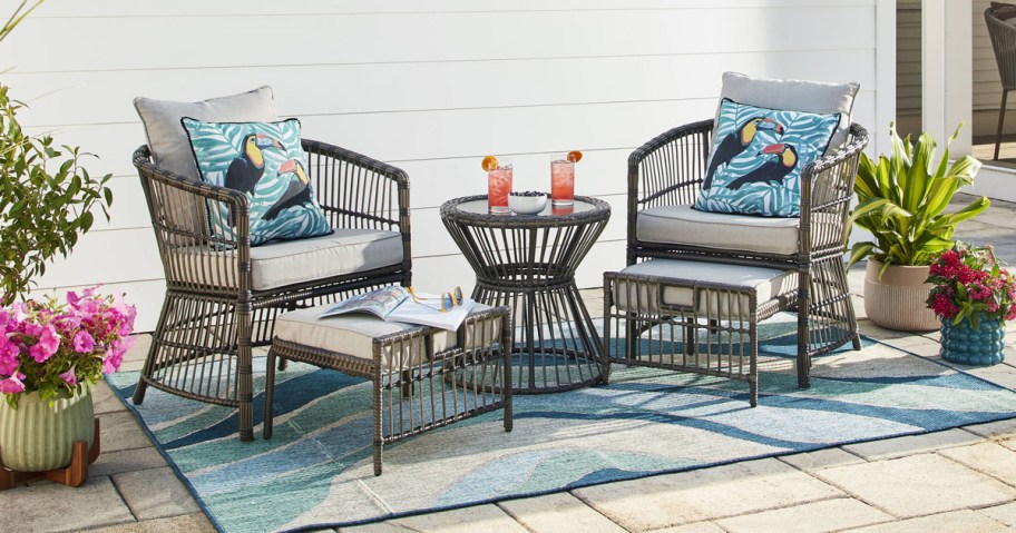 wicker patio chairs will pull-out ottomans and matching side table