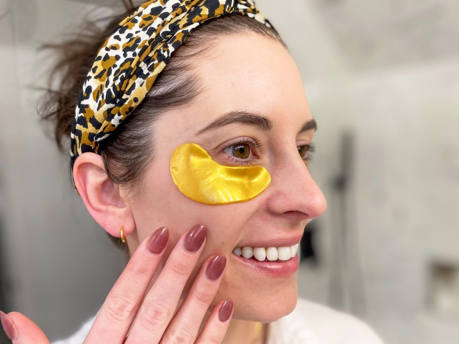 woman with gold under eye patches on her face