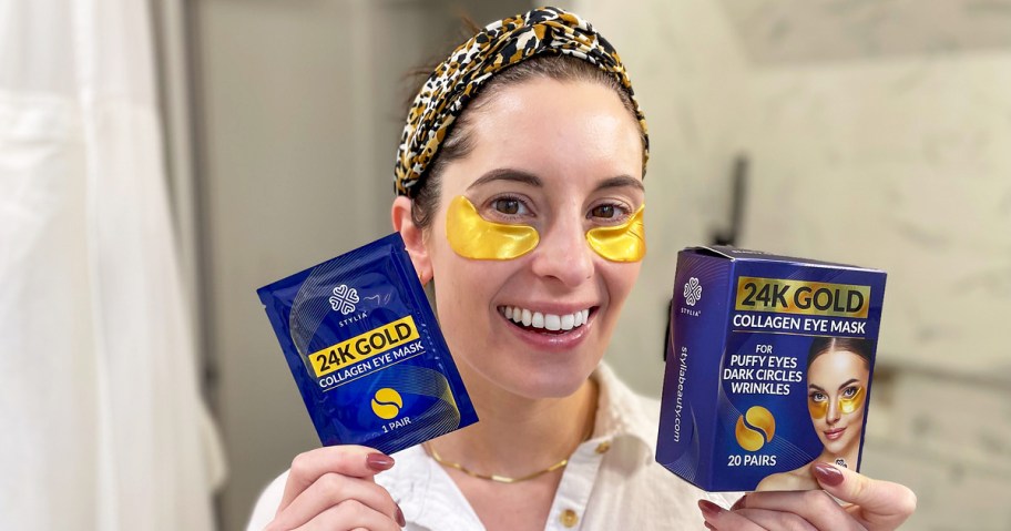 woman wearing a set of gold under eye patches and holding packaging