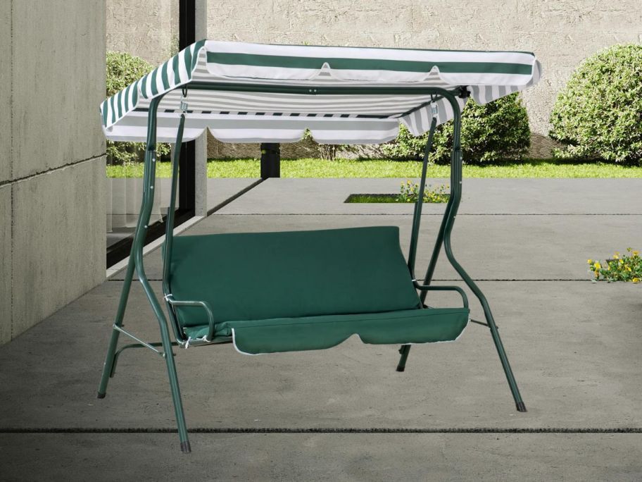 Sunjoy Durable Steel Frame 2 Person Outdoor Swing Chair with Adjustable Canopy & Comfort Cushions - Green on patio