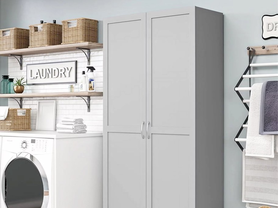 grey storage cabinet in laundry room