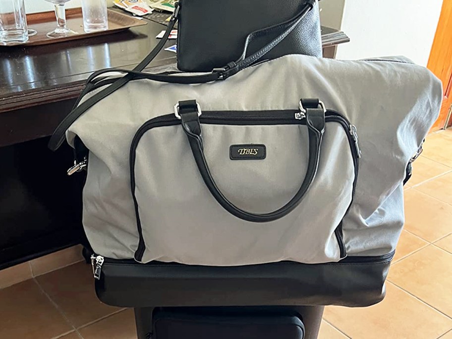 grey and black weekender bag