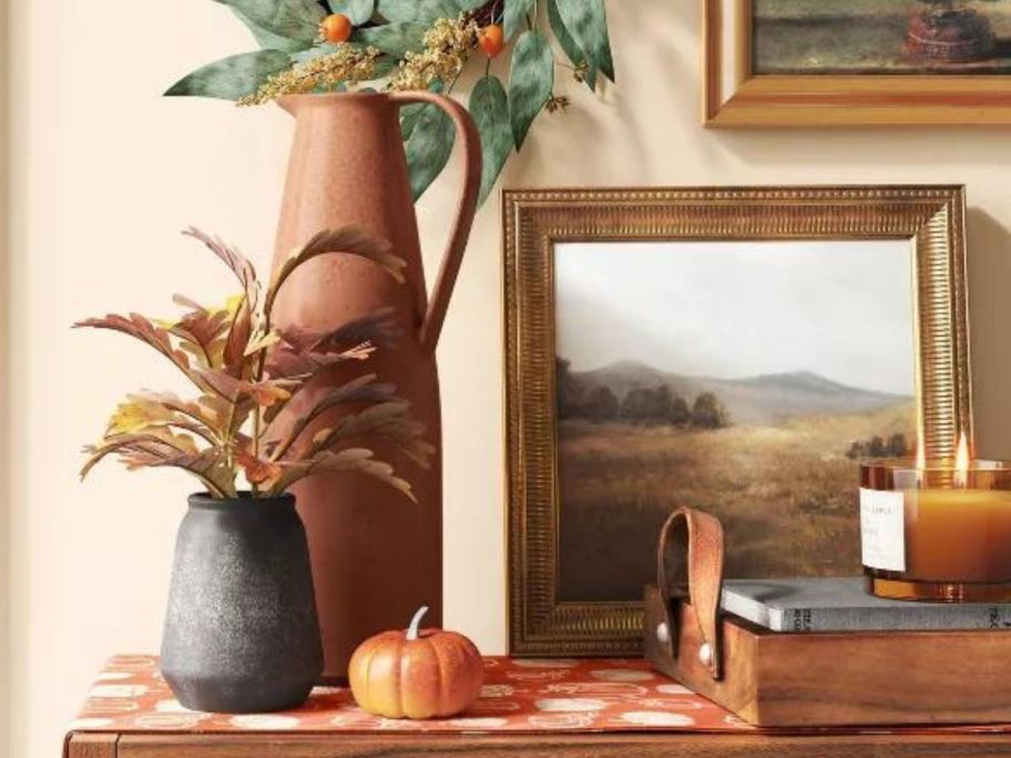 A Prairie Land Framed picture on a shelf