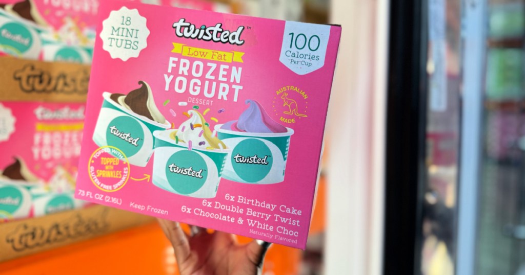 person holding box of Twisted Frozen Yogurt Cups inside Costco