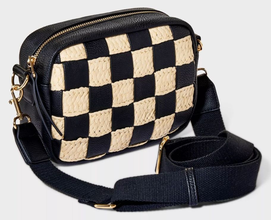 a black and white checkerboard crossbody bag