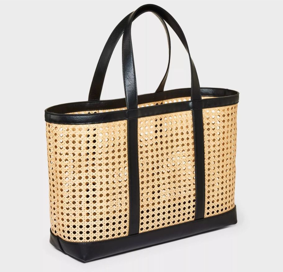 a caning tote bag with black trim