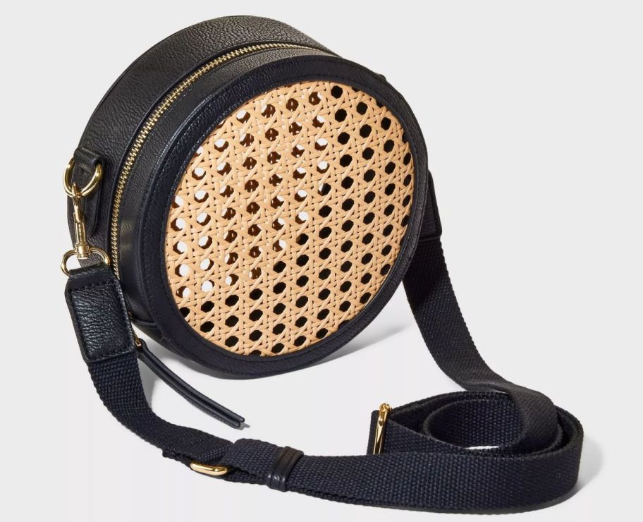 a canteen caning crossbody bag with black trim
