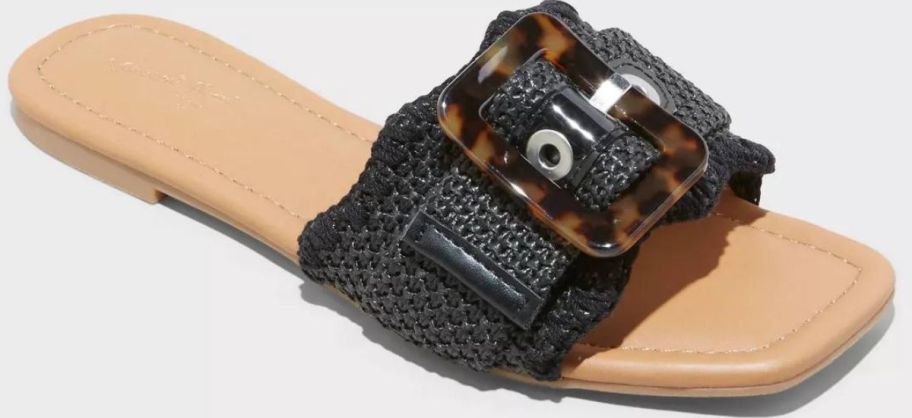 A Women's slide sandal in black and tan with a buckle