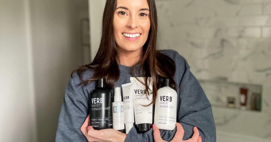 woman holding Verb Haircare products in her arms