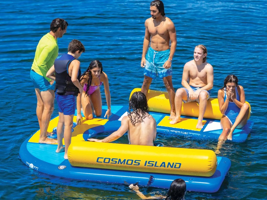 group of adults hanging out on blue and yellow floating dock