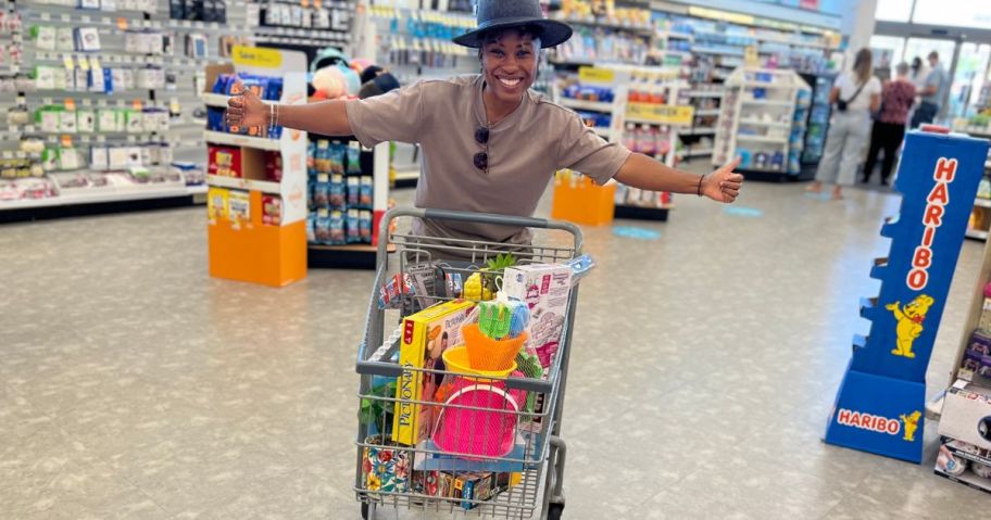 Woman with a cart full of Walgreens summer clearance items