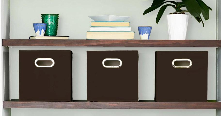set of dark brown fabric storage bins on wood shelf