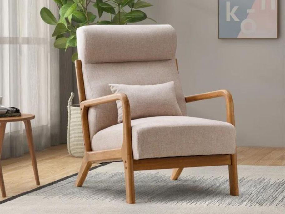 A Wade Logan Ayyash Upholstered Armchair i a living room