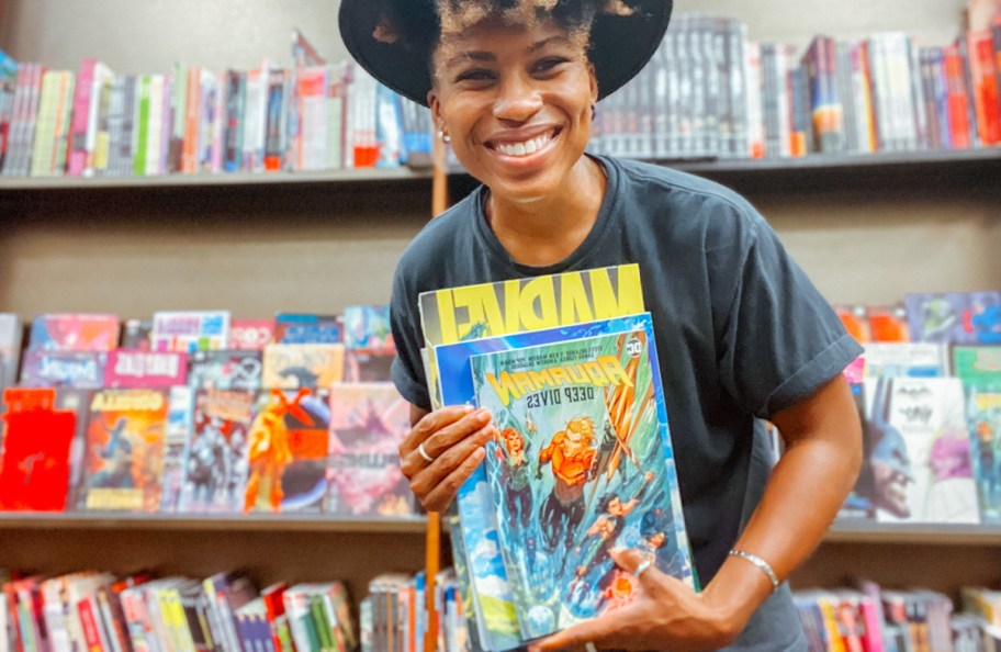 Woman holding comic book at the comic store