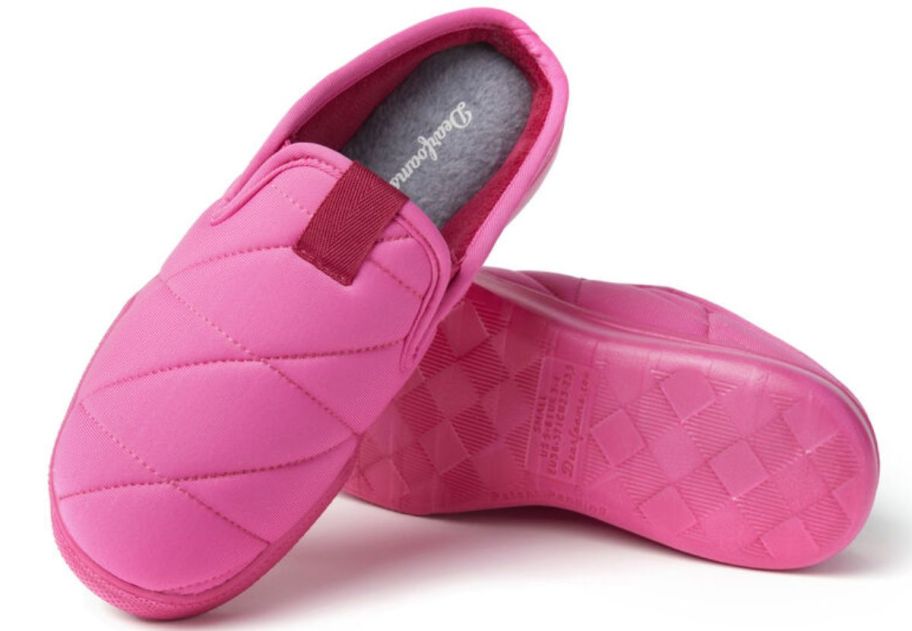 a pair of pink womens clogs