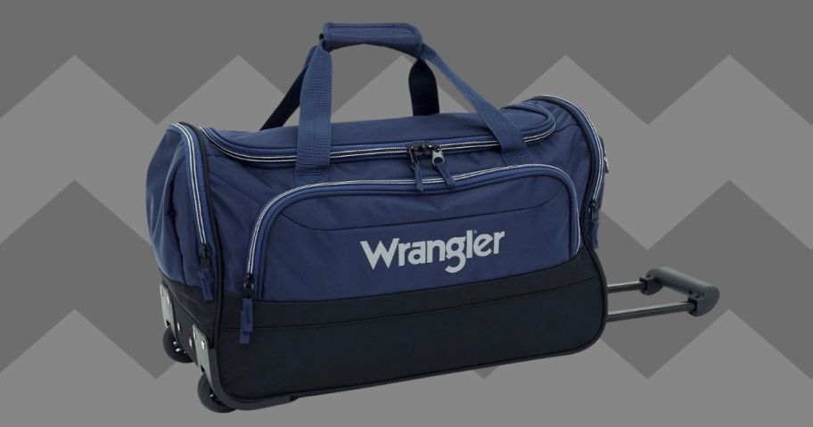 Wrangler 21" Deluxe Polyester Rolling Duffel against grey background