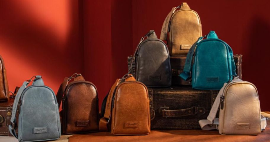 Seven Wrangler Crossbody Bags on display