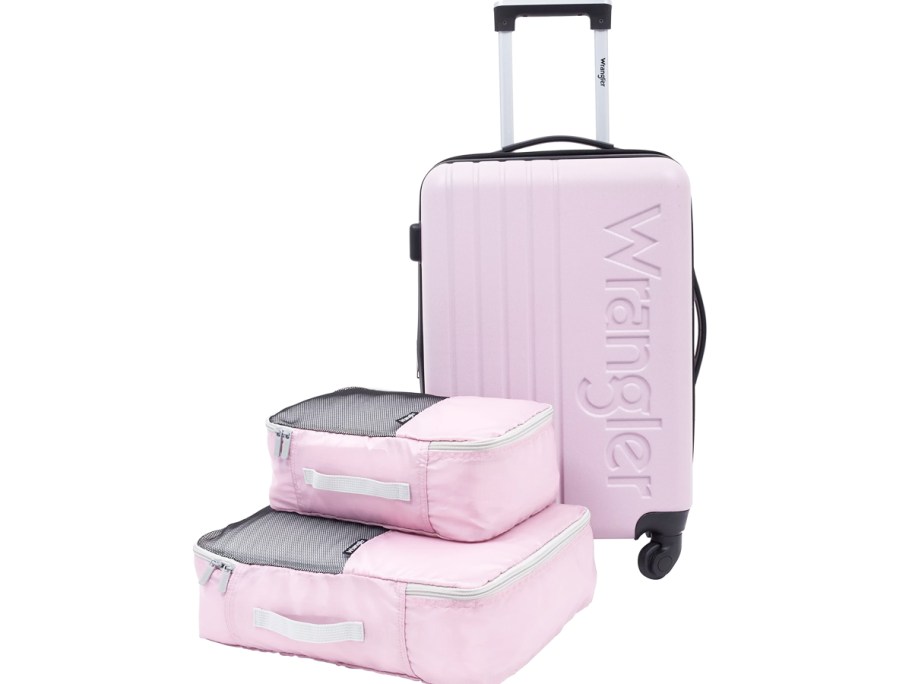 light pink hardside suitcase and matching set of packing cubes