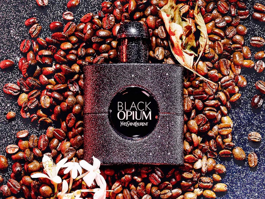 a bottle of Yves Saint Laurent Black Opium Eau de Parfum Extreme Spray in coffee beans