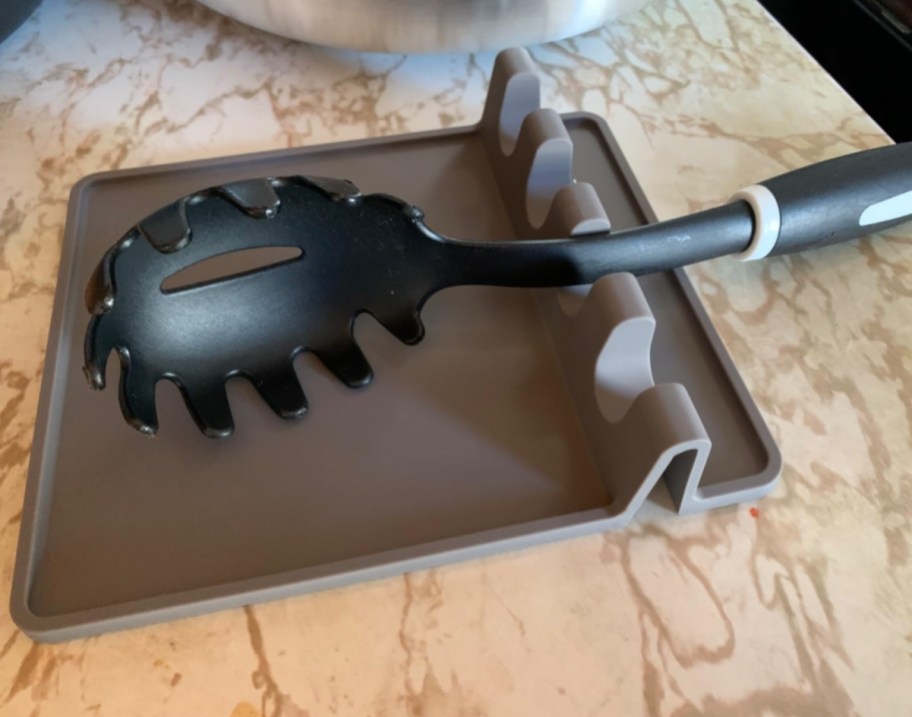 A Zulay utensil rack, one of the cool kitchen gadgets and awesome kitchen accessories of 2024