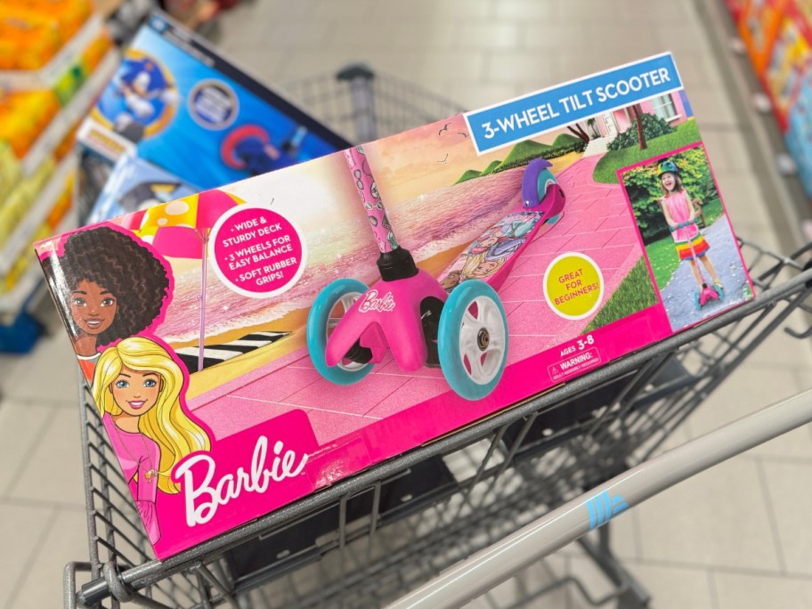 Barbie scooter in a box in a shopping cart