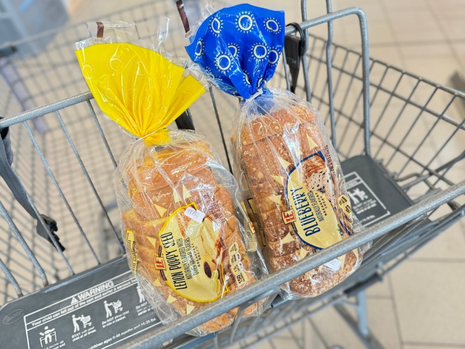 bags of lemon poppyseed and blueberry bread in a cart