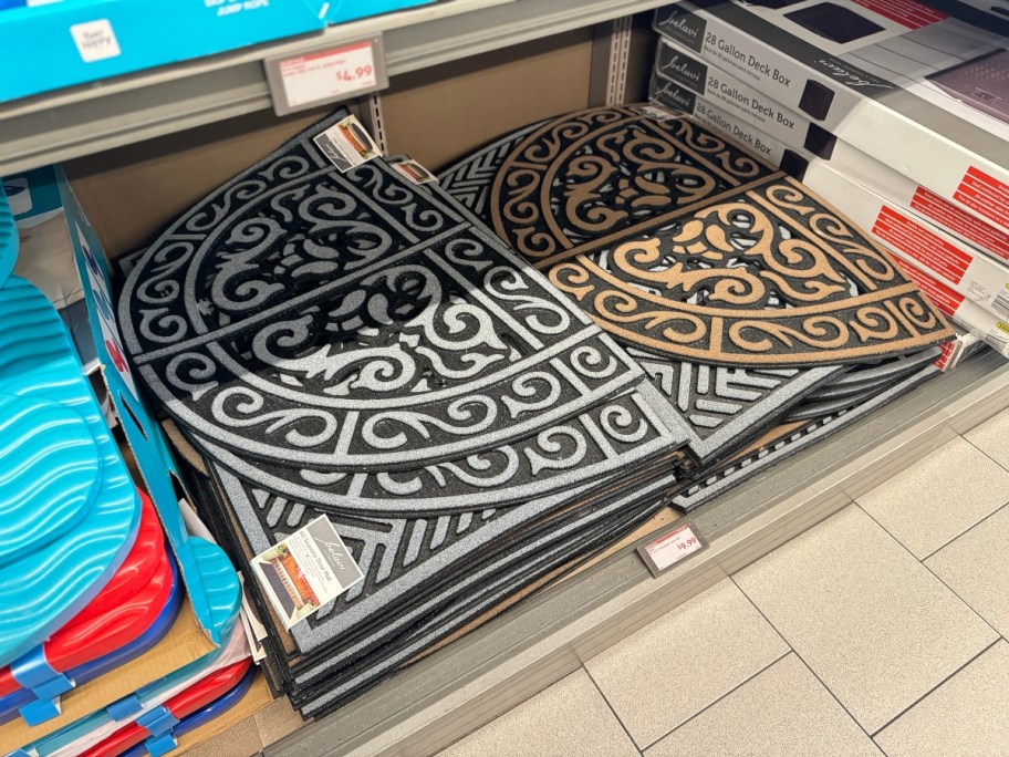 decorative door mats on shelf