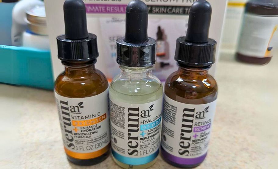 3 artnaturals serums on a bathroom counter