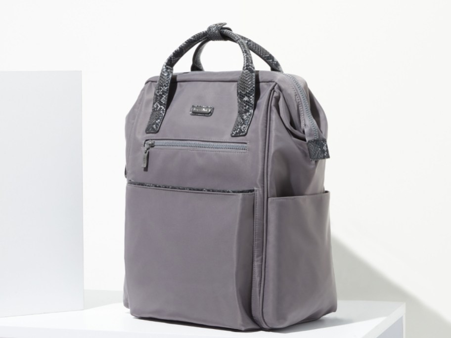 grey backpack with top handles