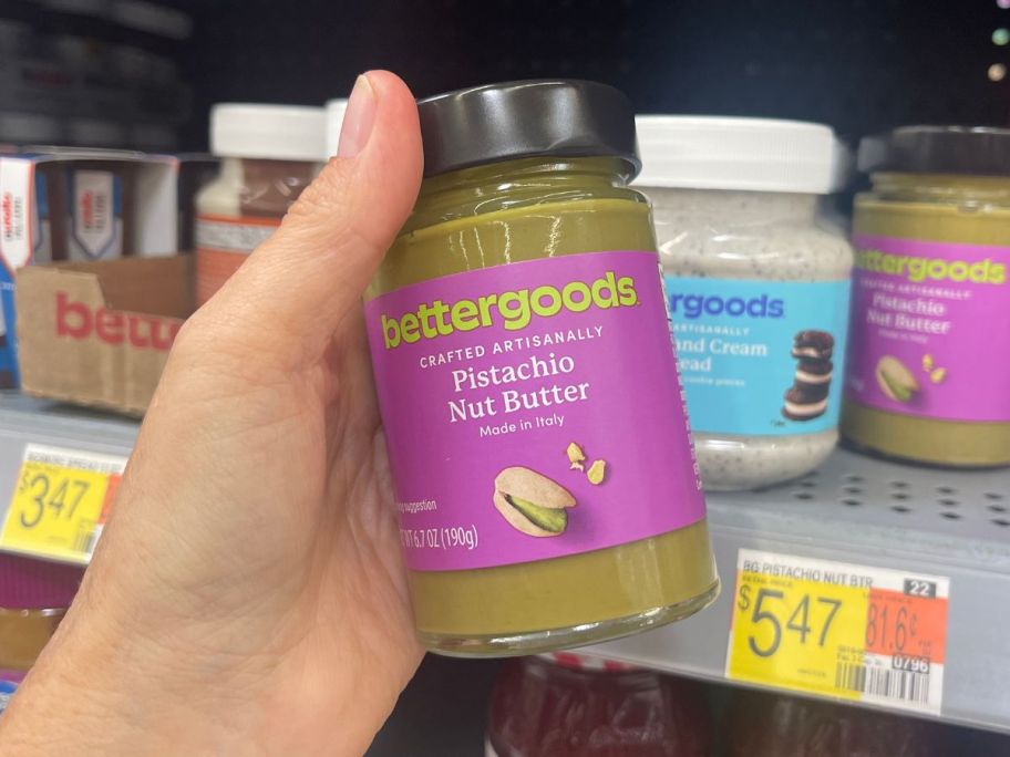 hand holding bettergoods Pistachio Nut Butter 6.7oz in store
