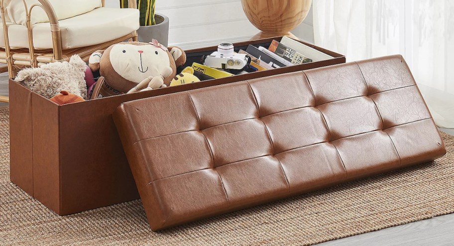 brown ottoman opened with toys exposed