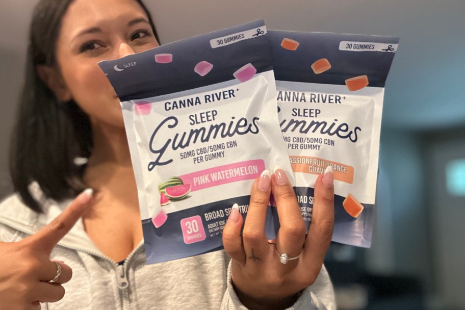 woman pointing to two bags of sleep gummies