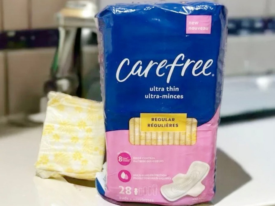 carefree ultra thin pack with pad sitting next to it 