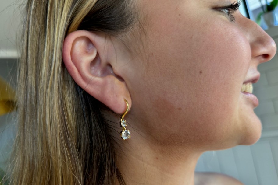 side profile of girl in earrings