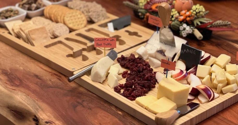cheese board on table with food on it