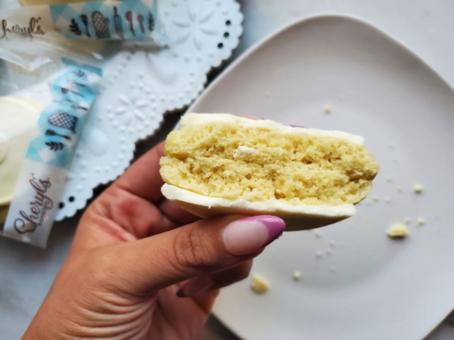 two cheryl's cookies pressed together to show detail above a plate