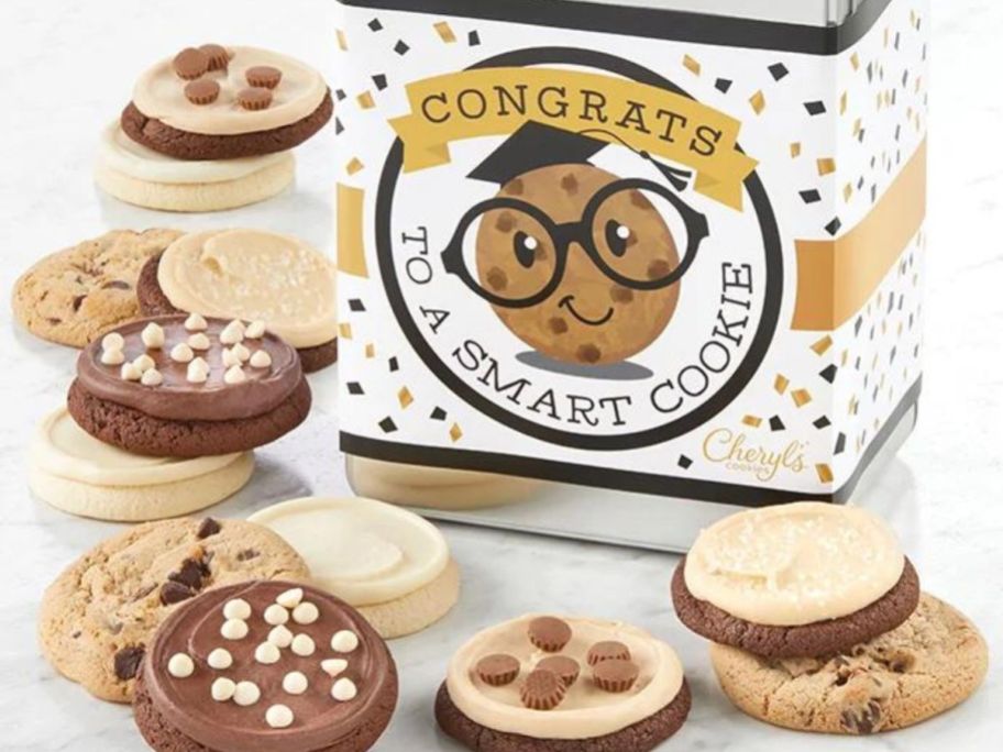 Graduation Cookie Gift Tin with cookies around it on table