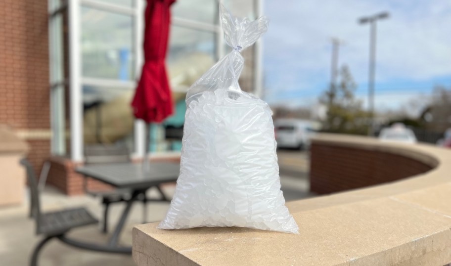clear bag of ice sitting on wall at chick fil a 