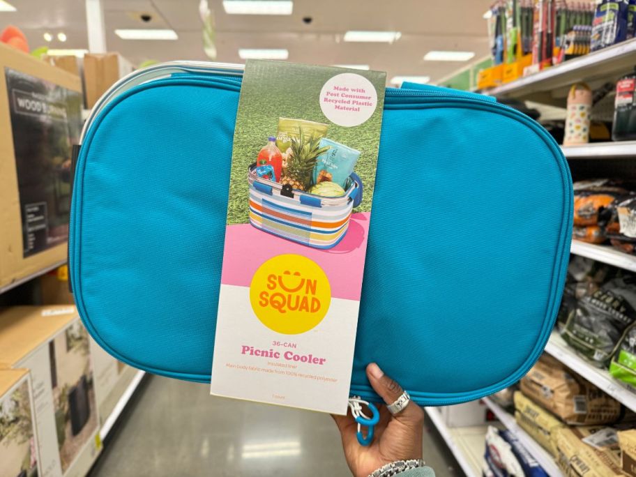 sun squad 36 Cans/13.5qt Picnic Soft Sided Cooler being held by hand in store aisle
