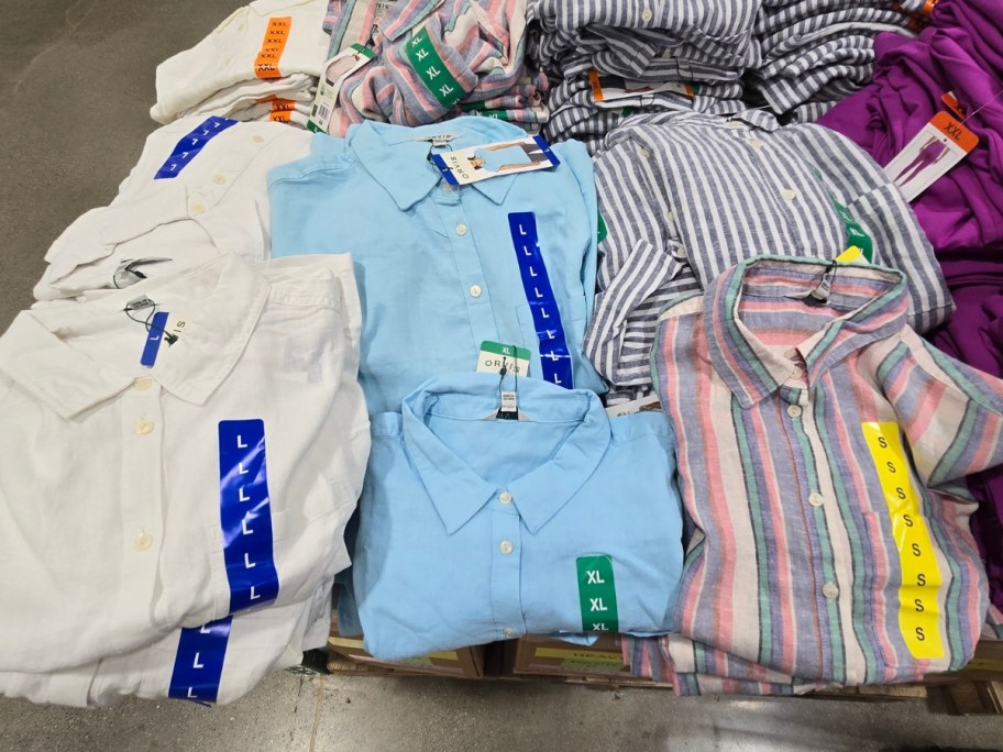 women's button up linen shirts on a display table