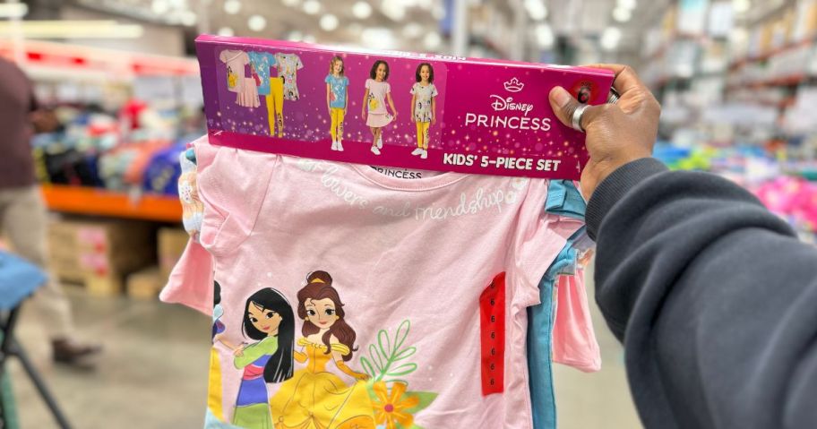 princess 5 piece clothing set being held by hand in costco store