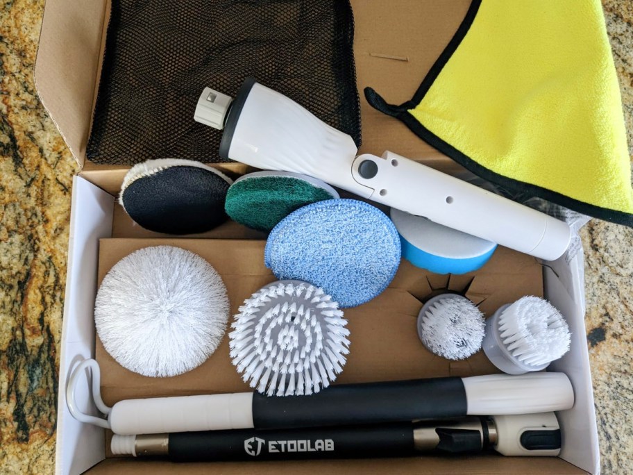 electric spin brush with accessories in box