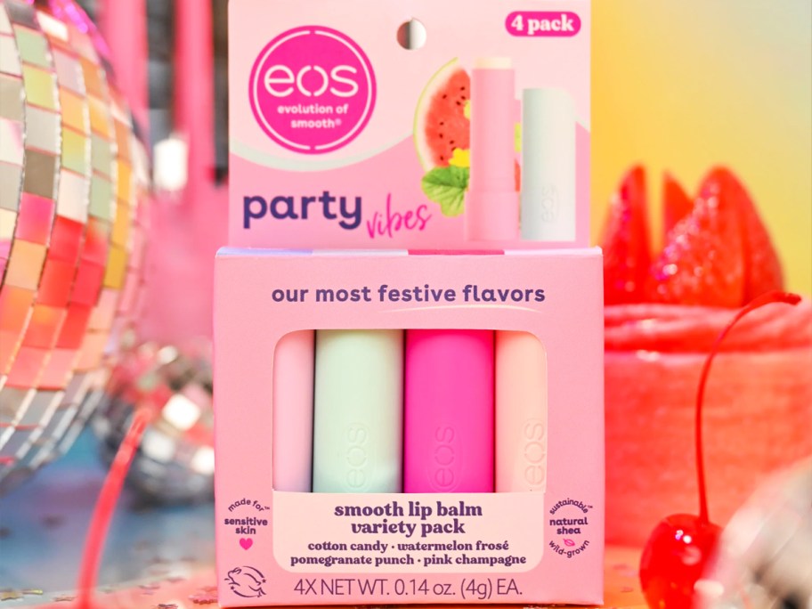 variety pack of eos lip balms near disco ball and cake