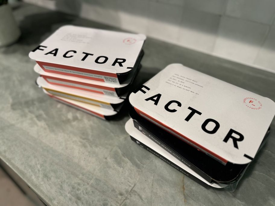 factor meals stacked on a counter top