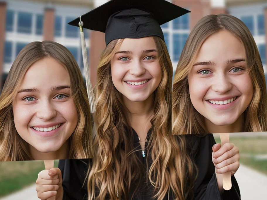 girl in graduation cap holding two bigheads on sticks
