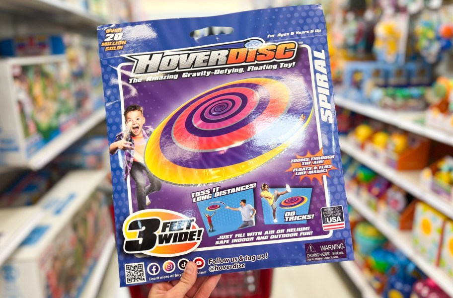 hand holding hover disc while shopping at target