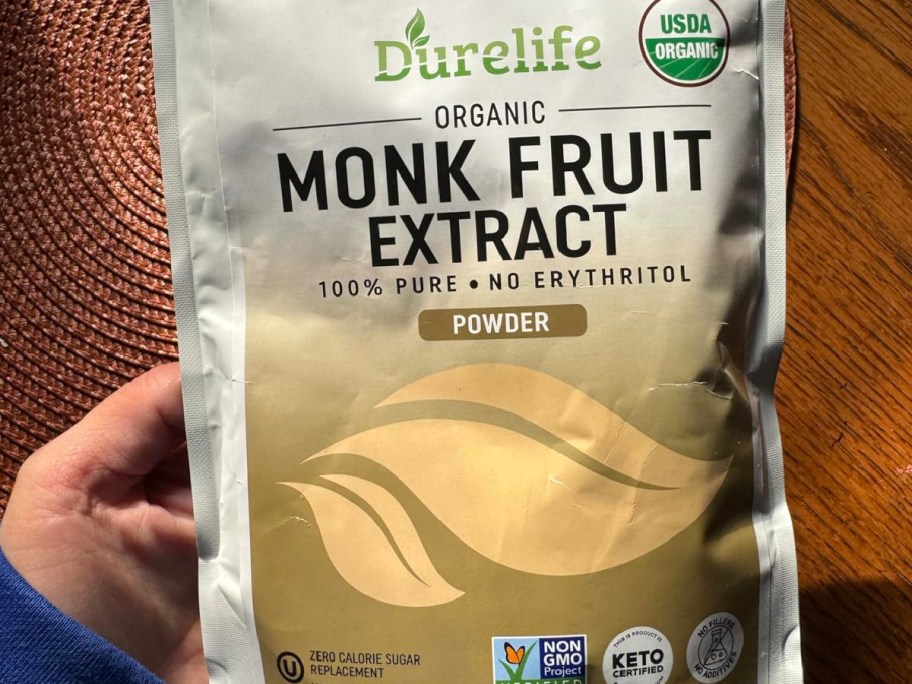 hand holding monk fruit extract bag