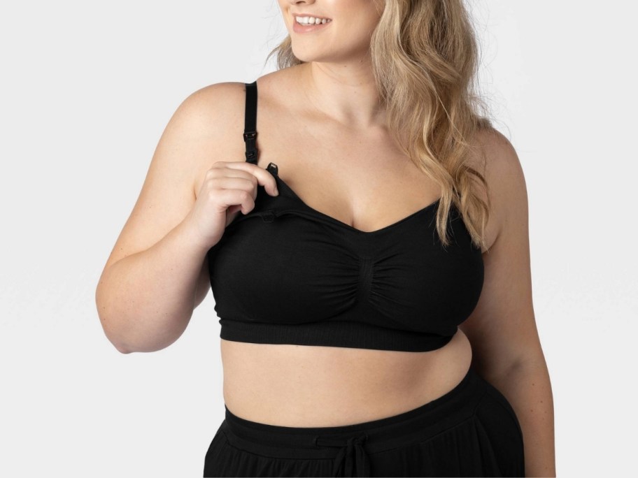 a woman in a black nursing bra