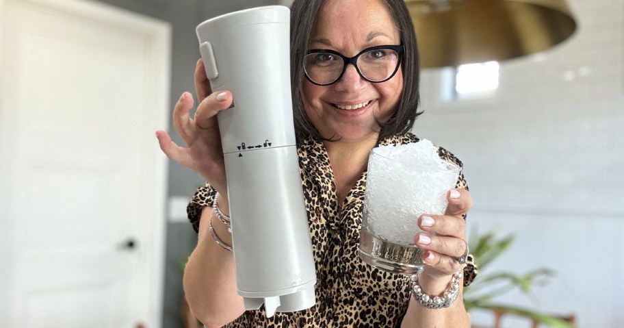 woman holding ice shaver and cup of ice